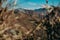 Artistic capture of distant, snow-covered Himalayan glaciers framed by deep valleys and rugged mountain ridges, in Uttarakhand,