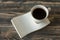 Artistic coffee cup with black coffee on wooden table