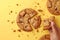 Artistic crumble Overhead view captures sweet cookies breaking on yellow