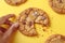 Artistic crumble Overhead view captures sweet cookies breaking on yellow