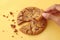 Artistic crumble Overhead view captures sweet cookies breaking on yellow