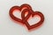 An artistic digital rendition of a neon sign featuring two interlinked hearts, glowing in a deep red hue for Valentine\'s Day