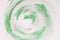 artistic green paint strokes circular shape white background. High quality photo