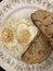 Artistic heart shaped eggs and toast