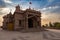 artistic hindu temple with dramatic sunset sky at evening from unique perspective