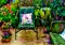 An artistic impressionist painting style of a colourful courtyard garden