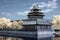 Artistic infrared shot of the Northwest corner tower of Forbidden City and Tongzi River in Beijing