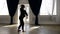 artistic male dancer is dancing alone in rehearsal room, contemporary choreography
