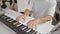 Artistic man\\\'s hands strum passionate melody on acoustic piano