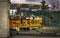 Artistic photo of an old rusty tram, behind the steel fence. Timisoara