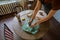 Artistic process in ceramics studio: female ceramist work with raw clay on pottery wheel on table