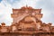 artistic red stone jain temple at morning from unique angle