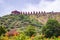 artistic series or red stone jain temple at mountain top at morning from unique angle