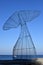 Artistic structure in the shape of a whale tail in liguria in camogli with blue sky background