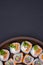 Artistic Sushi Arrangement on Wooden Platter