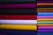 Artistic variety shade tone colors Textile Fabrics stacked on retail Shop Shelf