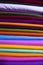 Artistic variety shade tone colors Textile Fabrics stacked on retail Shop Shelf