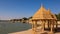 Artistically carved sandstone pavilions at the Lake Gadisar in Jaisalmer, Rajasthan, India