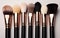 Artistry in Pastels: Collection of Makeup Brushes on a pastel Background