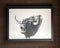 Artists charcoal painting of a bellowing bull titled `Bramido` on display inside the Molino El Vinculo olive oil mill near Zahara.