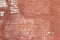 Artsy looking old salmon color painted brick wall texture with deterioration