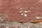 Artsy looking old salmon color painted brick wall texture with deterioration