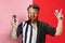 Artwork. Composite image of two halves of body of referee and hairdresser  on pink and red background. Concept