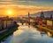 The artwork depicts the Arno flowing through the heart of Florence Italy.