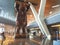 Artwork on show at Doha airport, picture of the monumental wooden art piece called SMALL LIE  by American artist KAWS