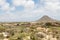 Aruba Desert Shacks with Mountain in Background