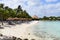 Aruba, Renaissance Island, Caribbean Sea. Sunny beach with white sand, coconut palm trees and turquoise sea. Summer vacation,