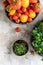 Arugula microgreen and different types of tomatoes. Organic harvest concept. Healthy lifestyle. Top view