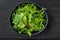 Arugula raab and Mangold, Swiss chard set, on black wooden table background, top view flat lay