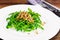 Arugula Salad with Germinated Grain in White Plate