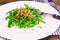 Arugula Salad with Germinated Grain in White Plate