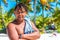 ARUTANGA, AITUTAKI ISLAND, COOK ISLAND - SEPTEMBER 30, 2018: Portrait of a cheerful man on a sandy beach. With selective focus