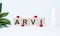 ARVI. Text abbreviation on wood cubes blocks on light blue background. Most commonly diagnosed mental disorder of children. Close