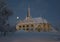 Arvidsjaur church with moon. Winter in Lapland, Sweden, Norrbotten