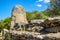 Arzachena, Sardinia, Italy - Archeological ruins of Nuragic necropolis Giants Tomb of Coddu Vecchiu  - Tomba di Giganti Coddu