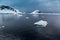 As icebergs and glaciers melt, small chunks break off and float away