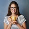 As long as theres coffee, therell be happiness. Studio shot of an attractive young woman holding a coffee mug against a