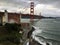 As a Red and White ferry passes under the famous Golden Gate Bridge, the hidden second bridge is visible.