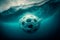 As the soccer ball sinks deeper into the ocean, it becomes a lost relic of a game played on land.
