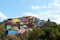 Asalpha hilltop  with a line of colorful slums, Ghatkopar, Mumbai, Maharashtra