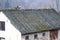Asbestic tile on the barn roof, Bieszczady Mountains, Poland. Dangerous asbestos roofs are still common in the poverty parties of