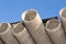 Asbestos cement pipes against the blue sky