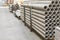 asbestos pipes in a stack in a warehouse or in a building store. Pallets with sewer pipes.