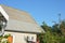 Asbestos roof with house metal gutter and air duct