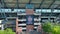 ascending aerial footage of Bobby Dodd Stadium at the Georgia Institute of Technology with lush green trees and skyscraper