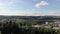 Ascending drone flight with aerial view over forest and Brugg, main town of a district in canton Aargau, Switzerland